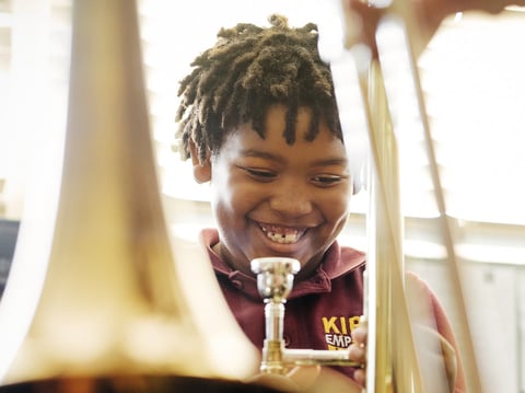 Amir Pinkney-Jengkens, 8, is learning trombone through Harmony Project, a nonprofit that provides musical instruments and instruction to children in low-income communities. 